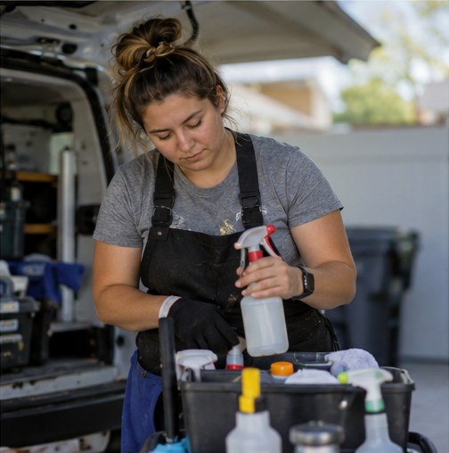 Cleaning business owner organizing supplies before a job